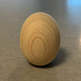 Egg-shaped wooden aroma diffuser by HONO-KA, showing the natural wood grain