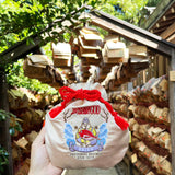 MYUUA Ebisu God of Fortune Drawstring Pouch — lifestyle styling shot